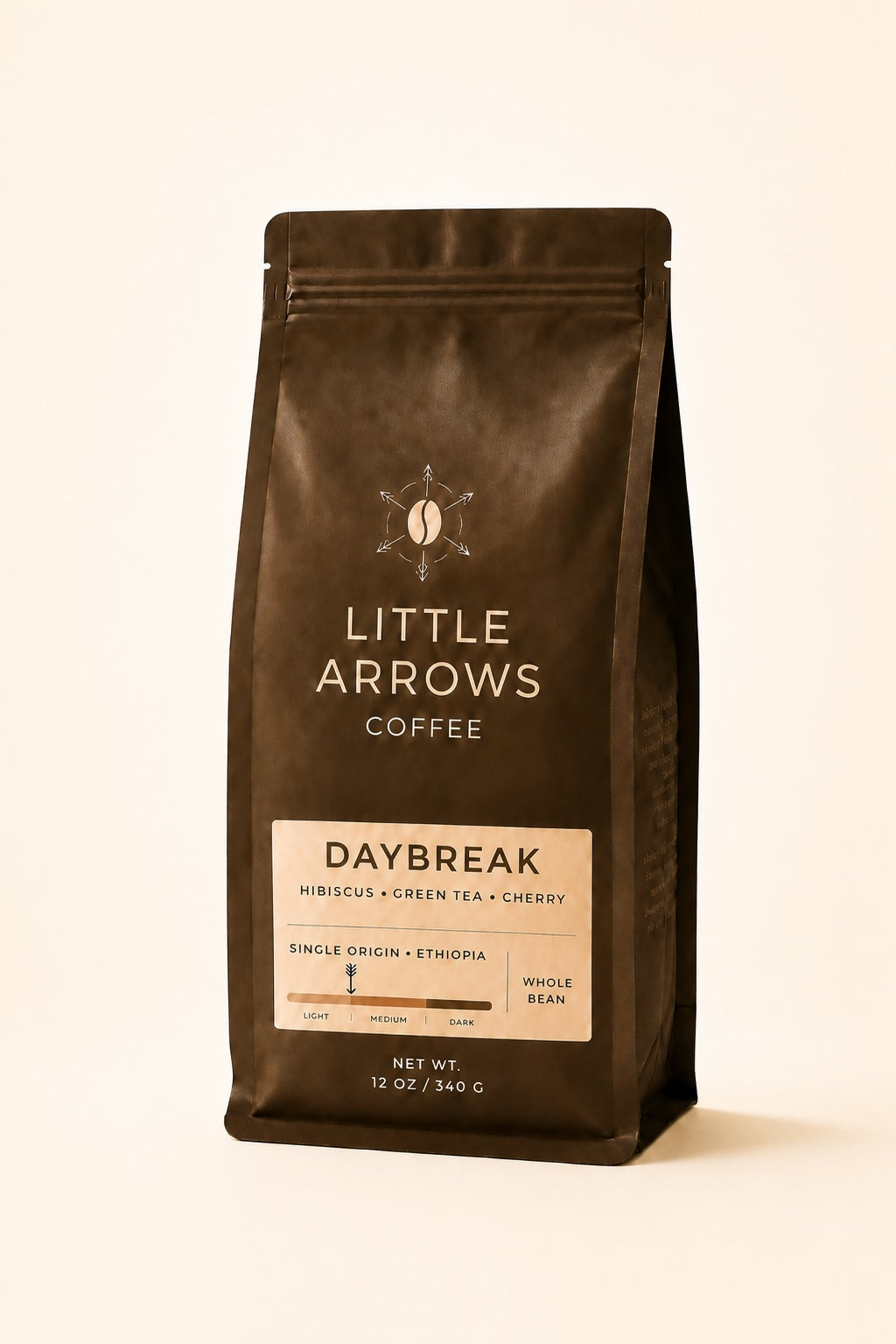 Coffee bag from Little Arrows Coffee with 'Daybreak' flavor on a beige background